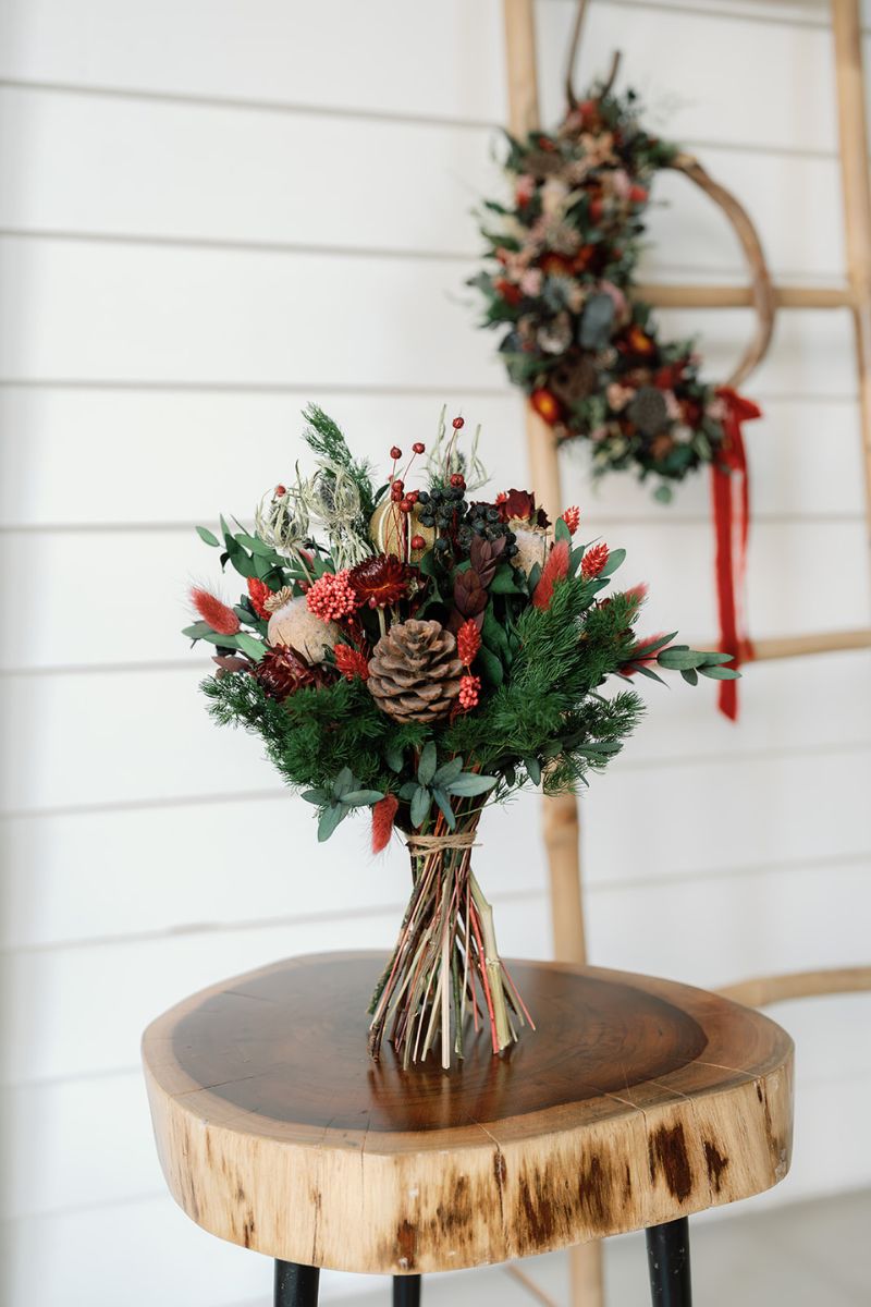 Winter dried flower bouquet in red, green and browns
