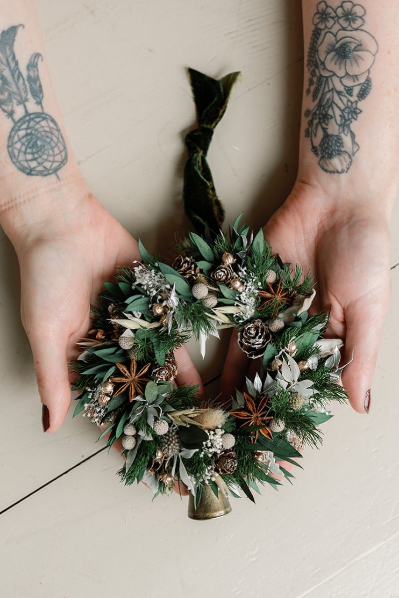 Decorative dried flower wreath bauble with brass bell and velvet ribbon