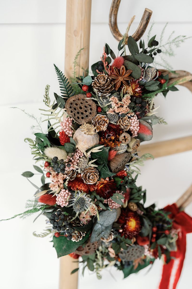 Decorative wreath with natural elements on a white background