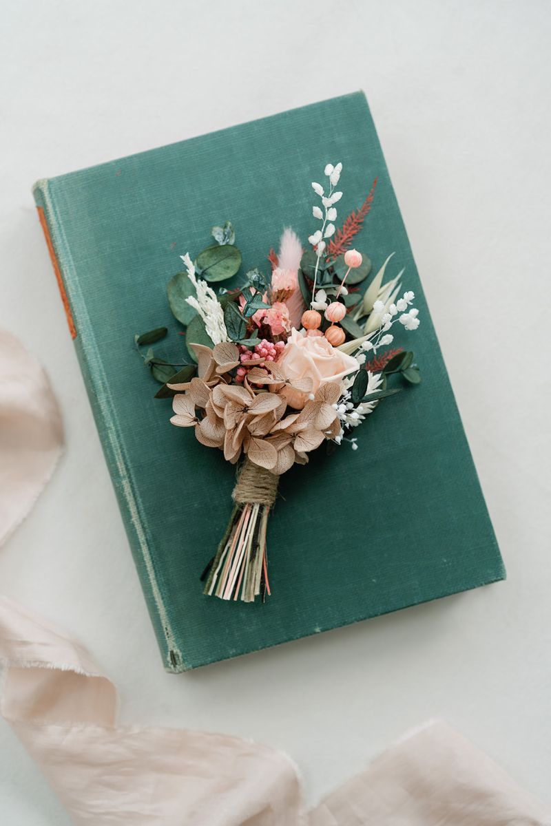 Summer wedding coral pink dried and preserved flower buttonhole for grooms.