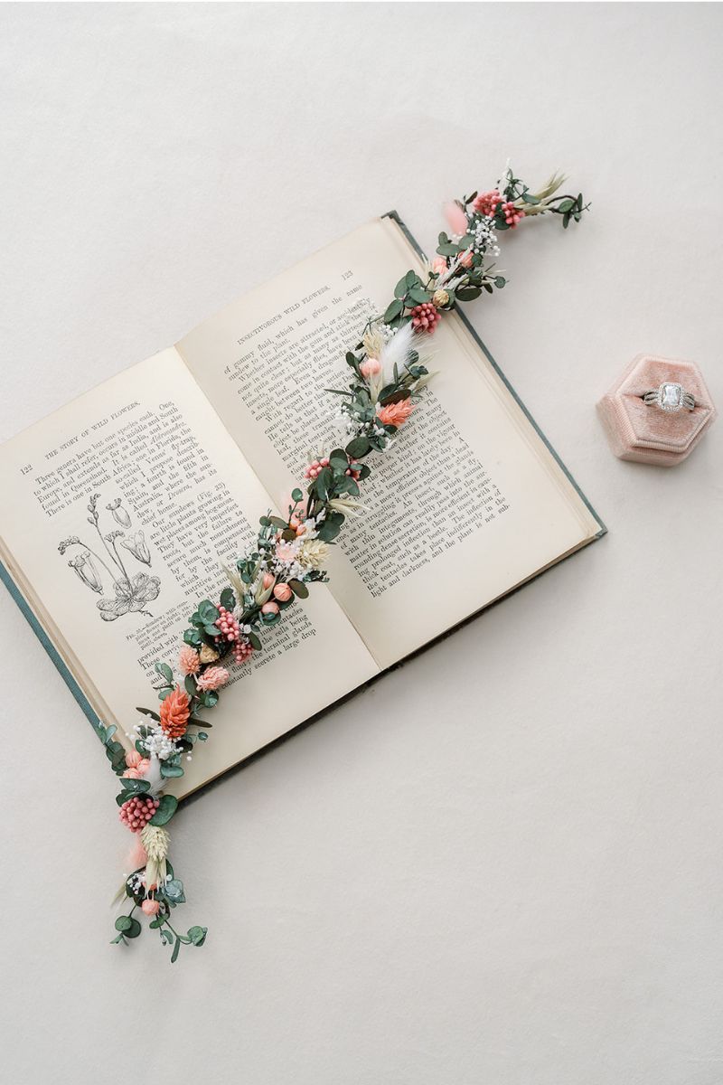 A delicate dried flower hair vine in coral, pink, white and green by Luna and Wild