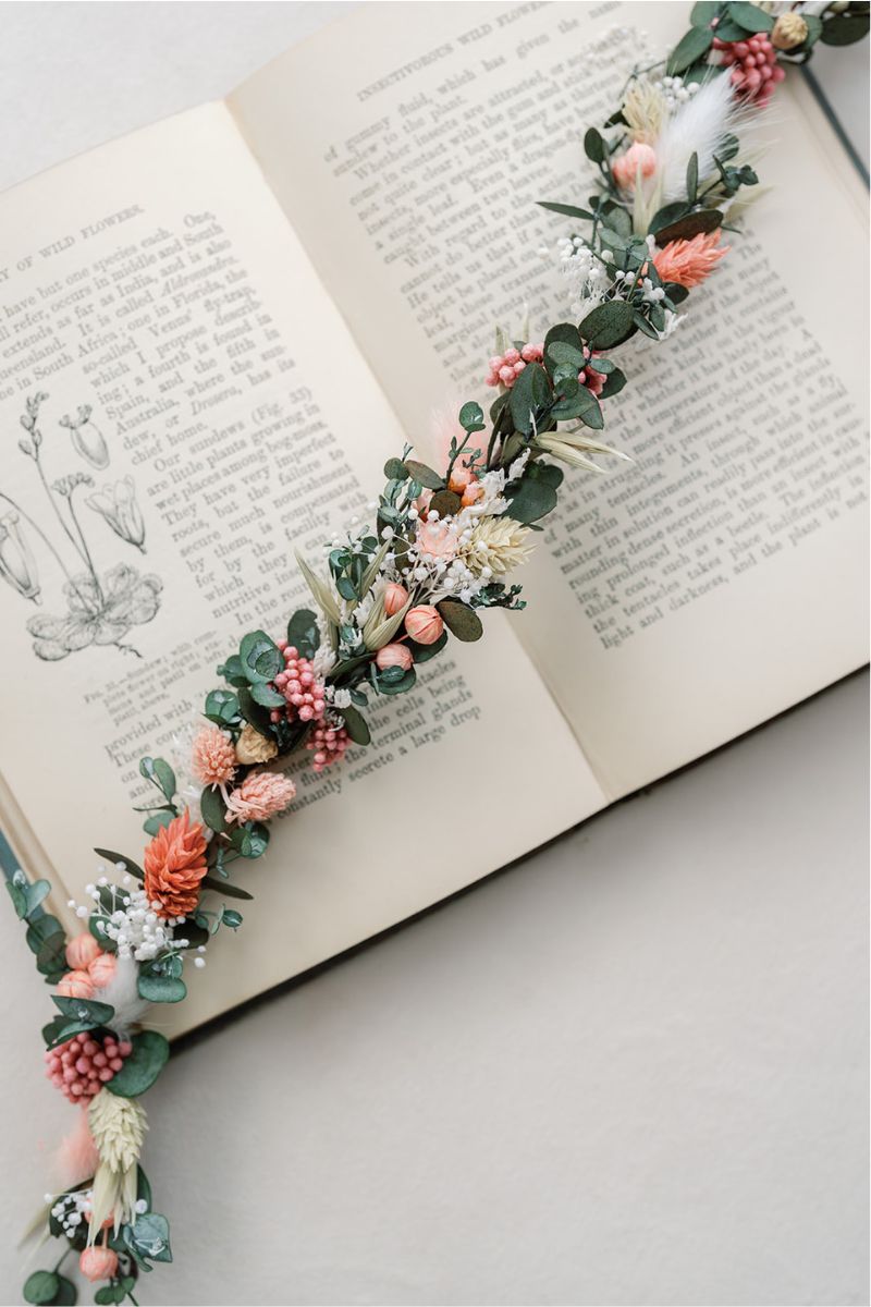 A delicate dried flower hair vine in coral, pink, white and green by Luna and Wild