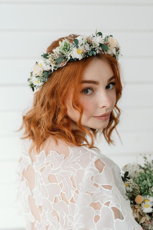 Dried and preserved bridal flower crown in peach, white and sage green tones, tied with a silk ivory ribbon.