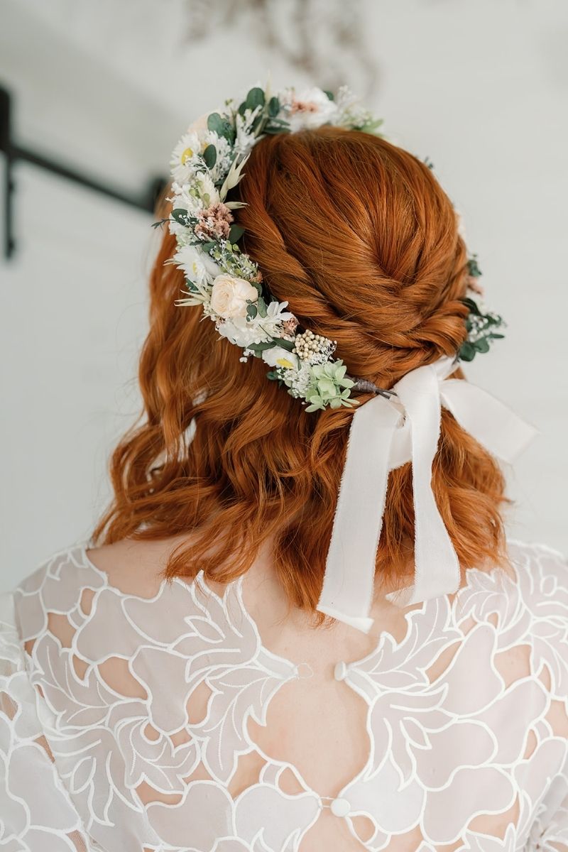 Dried and preserved bridal flower crown in peach, white and sage green tones, tied with a silk ivory ribbon.