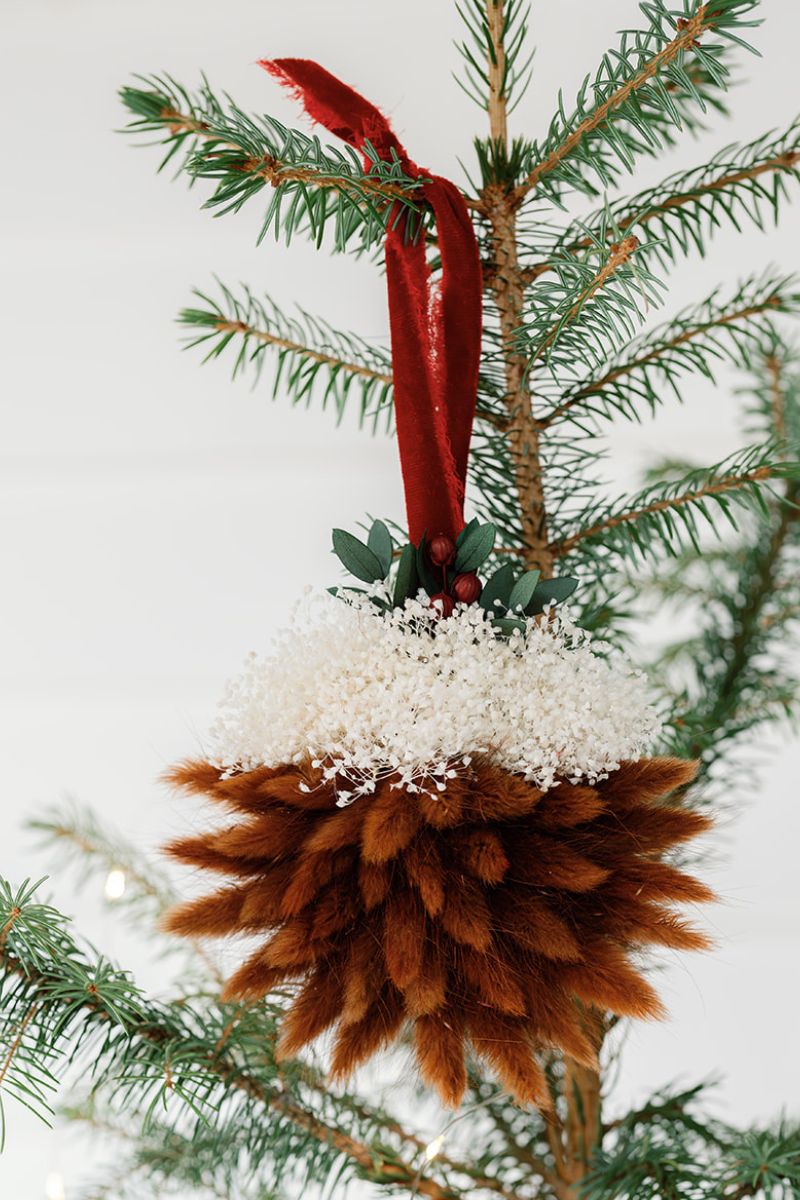 Christmas pudding bauble ornament with red ribbon