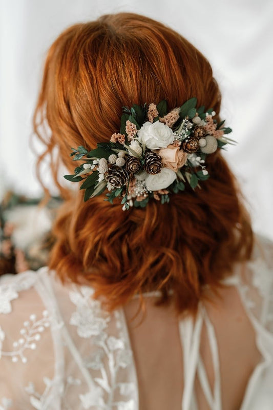 Inspired by frosty mornings, this winter whites wedding dried flower hair clip features preserved roses in nude and white, surrounded by lush foliage and silver berries.