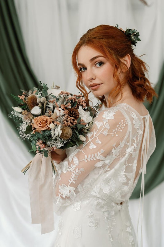 Rustic winter wedding inspired dried and preserved bridal bouquet with nude, white, silver and green tones, hand tied with silk ribbon.