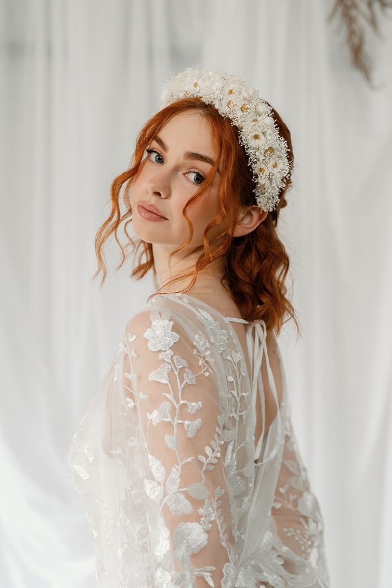 Ivory Daisy and gypsophila dried flower crown headband worn by a model with red short hair styled in a boho half up half down