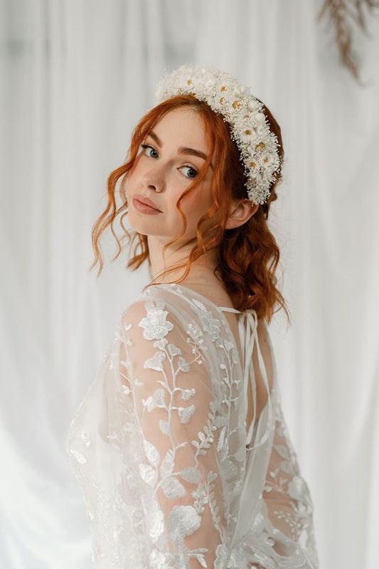 Ivory Daisy and gypsophila dried flower crown headband worn by a model with red short hair styled in a boho half up half down