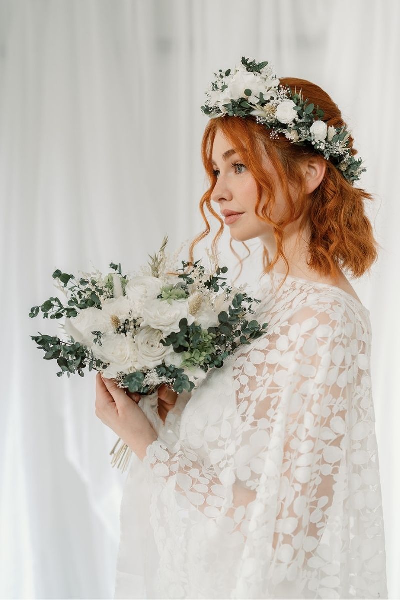 Preserved flower bridal bouquet with white peonies, roses and lime green hydrangea with lush eucalyptus foliage and finished with a silk ribbon around the stems