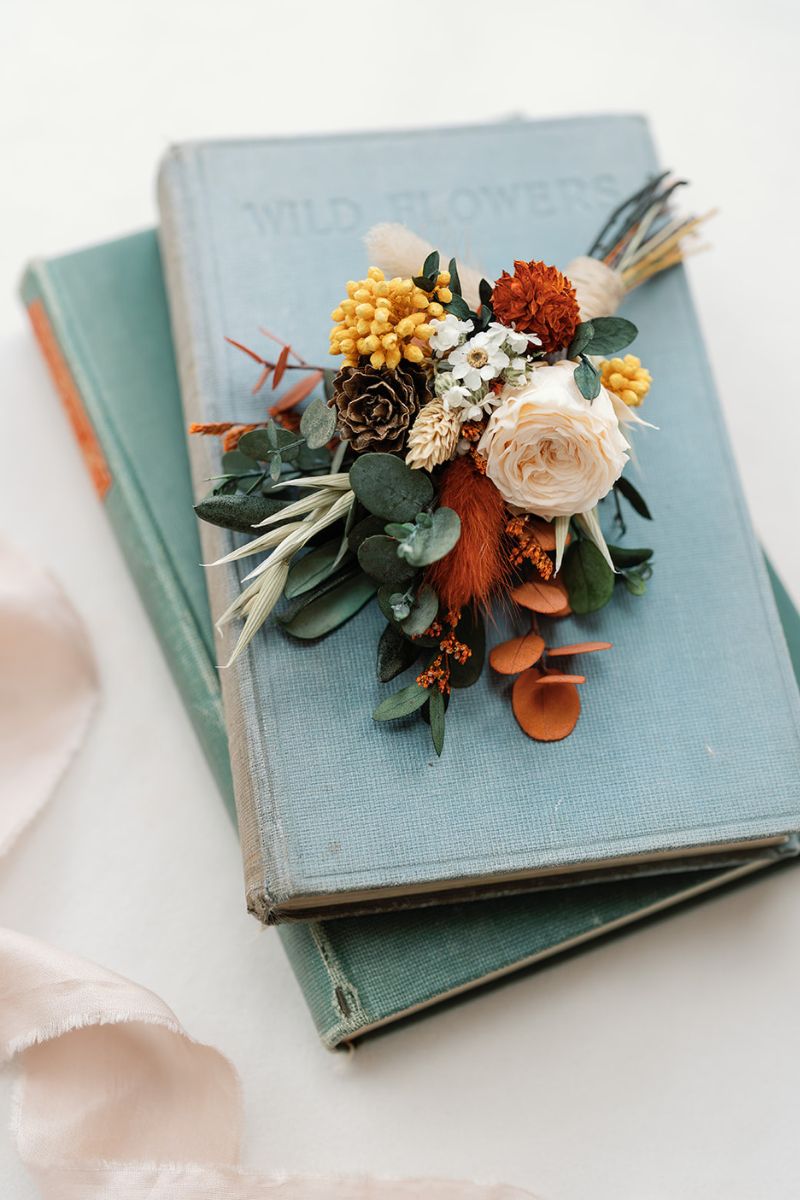 autumnal colour themed dried and preserved flower buttonhole, hand finished with crown twine.