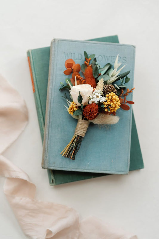 autumnal colour themed dried and preserved flower buttonhole, hand finished with crown twine.