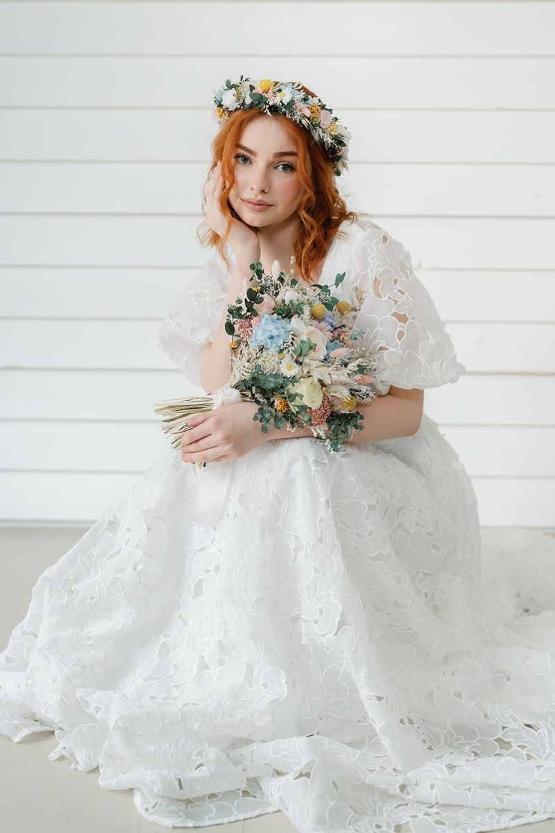 Pastel garden style dried and preserved bridal bouquet with roses, daisies, hydrangeas and eucalyptus