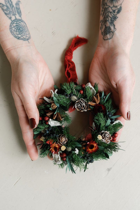 decoration mini dried flower wreath bauble held in hands for scale