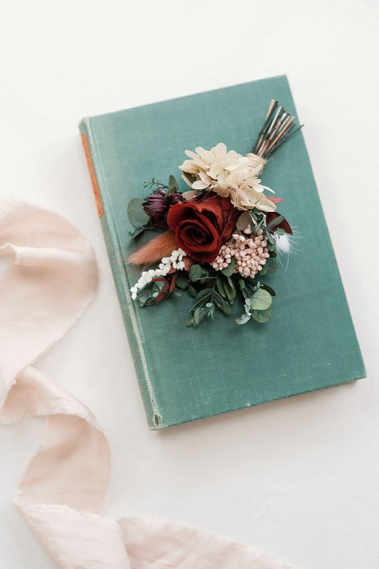 Preserved red rose buttonhole, dark, romantic and moody by Luna and Wild.