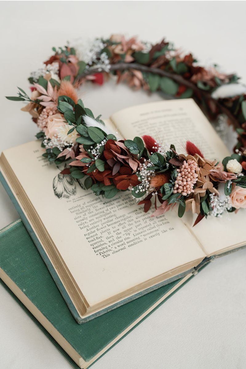 Close up of Scarlett, a moody and romantic, full halo preserved flower crown in red wine and dusky pink colour scheme by Luna and Wild.