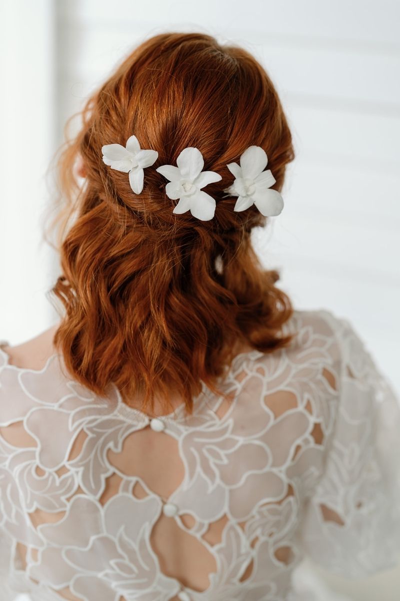 white preserved orchid hair pins perfect for beach weddings by luna and wild