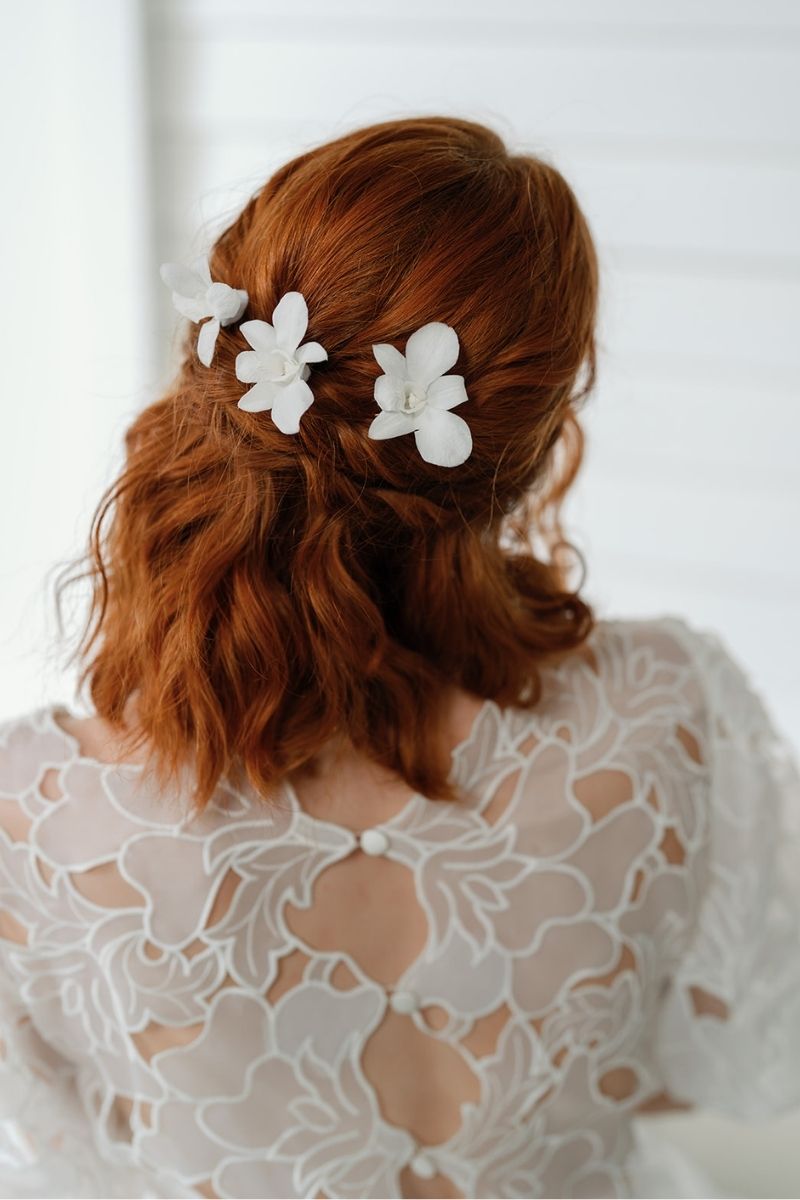 white preserved orchid hair pins perfect for beach weddings by luna and wild