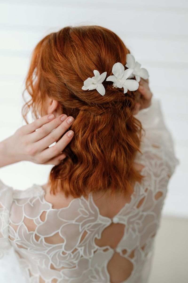 white preserved orchid hair pins perfect for beach weddings by luna and wild