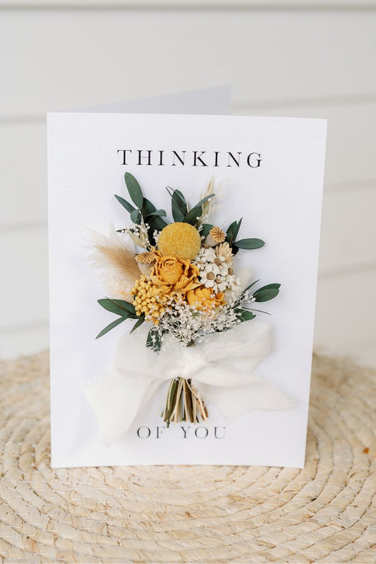Mini dried flower hand tied bouquet attached to a white A5 card reading "Thinking of you" by Luna and Wild