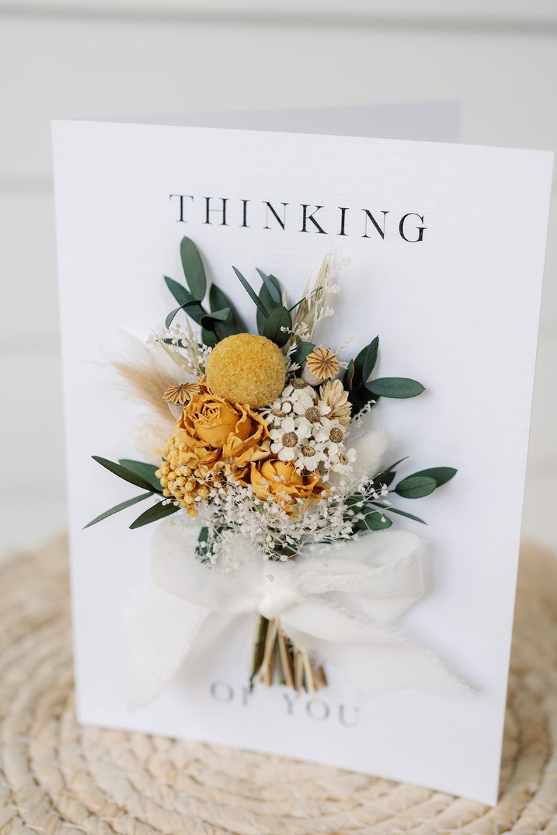 Mini dried flower hand tied bouquet attached to a white A5 card reading "Thinking of you" by Luna and Wild
